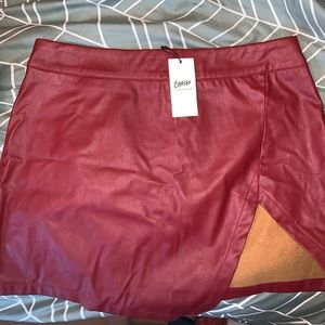 Red asymmetrical leather skirt